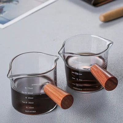 100 ml de copa de medición de vidrio de borosilicato transparente con tapa estilo de diseño minimalista