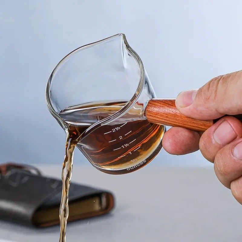 100 ml de copa de medición de vidrio de borosilicato transparente con tapa estilo de diseño minimalista